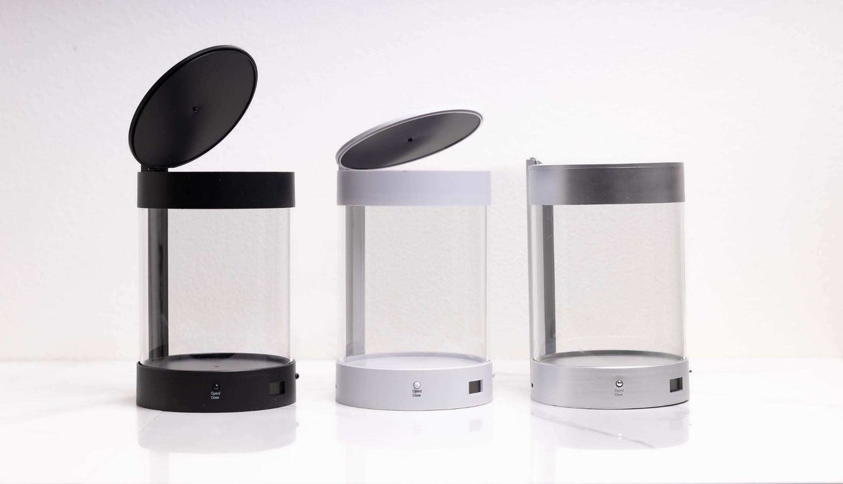 Side view of ALEC in black, white and silver with lids open